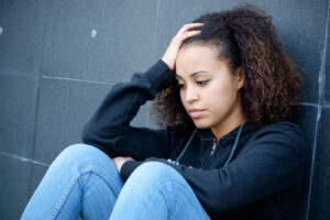 depressed teenage girl sitting