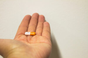 Adderall pill in a hand